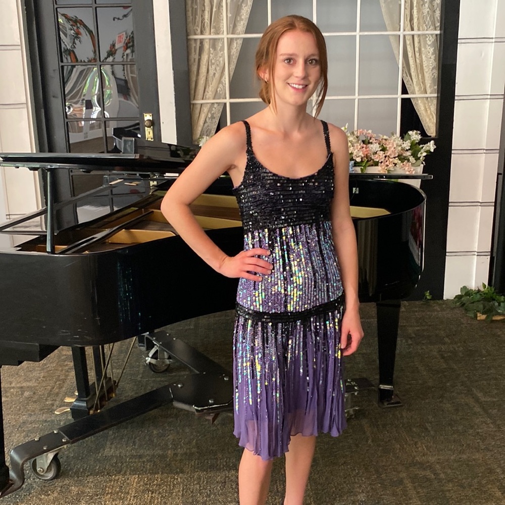 Purple and black to sequenced party dress used in a musical on stage